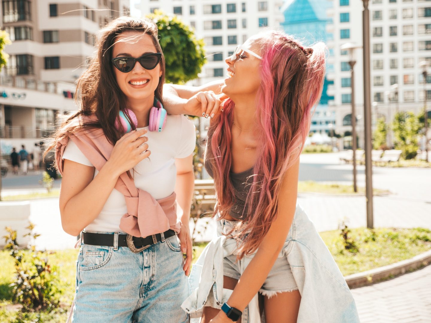 Two beautiful women posing outdoors